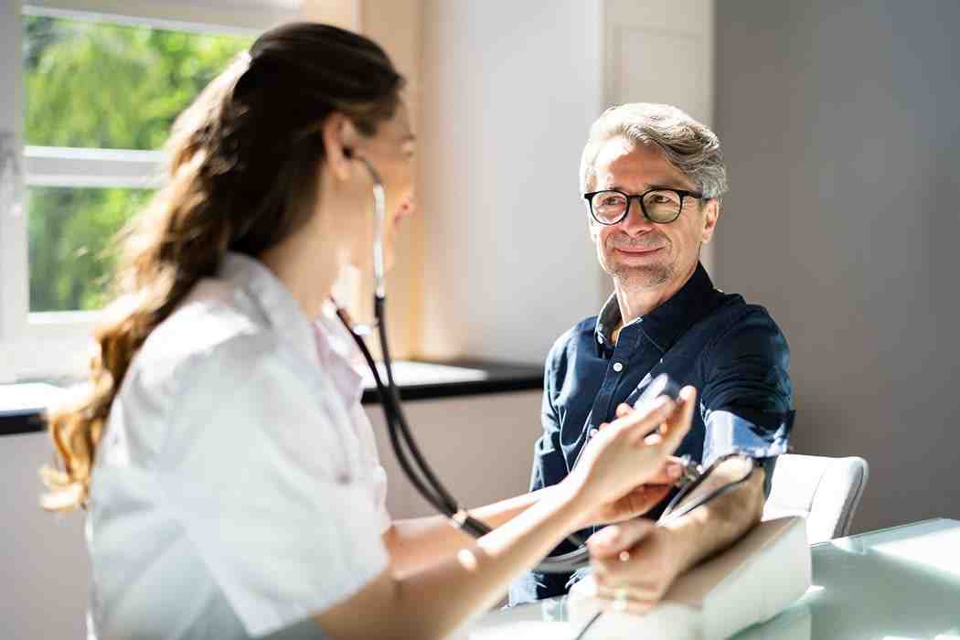 Doctor measuring patient's blood pressure